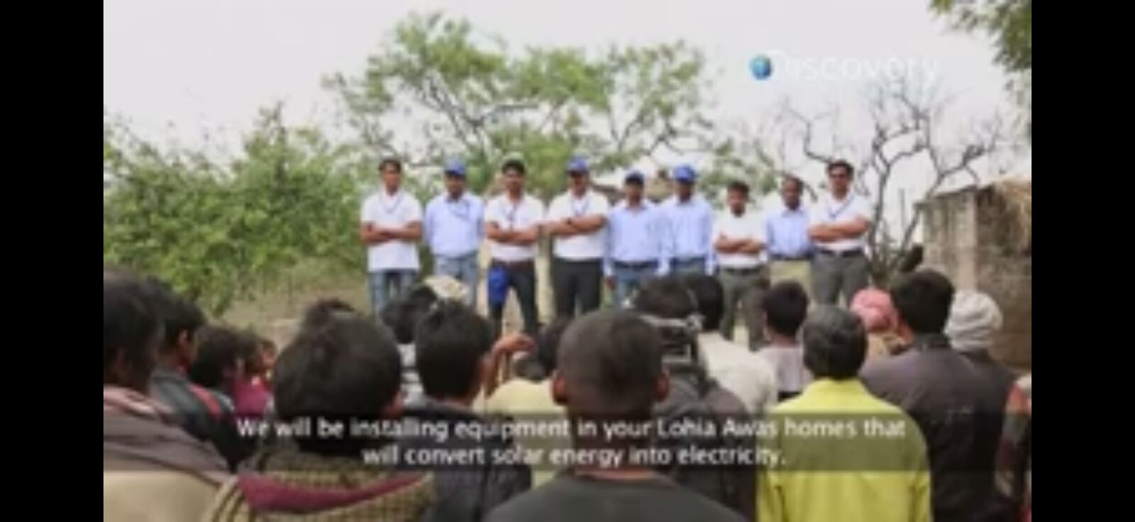 Su-Kam team explaining solar to a village gathering — 